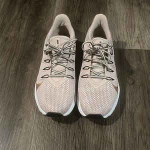 Women’s rose gold Nike quest running shoes